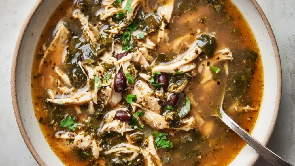 Chicken poblano soup with shredded chicken, black beans, and herbs