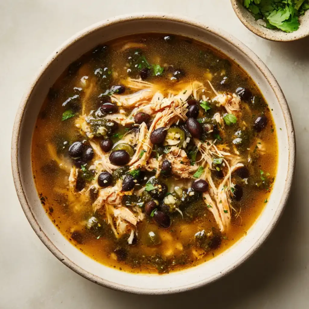 Chicken poblano soup with shredded chicken and fresh herbs