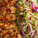 Low carb glazed chicken thighs served with crunchy cabbage slaw