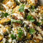 Crispy Mexican street corn Brussels sprouts with cotija cheese, cilantro and creamy lime sauce