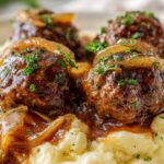salisbury steak meatballs with onion gravy on mashed potatoes